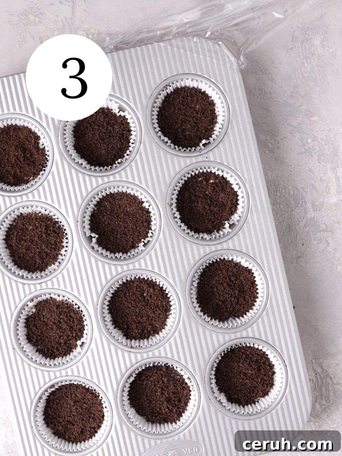 Muffin pan with Oreo crumbs