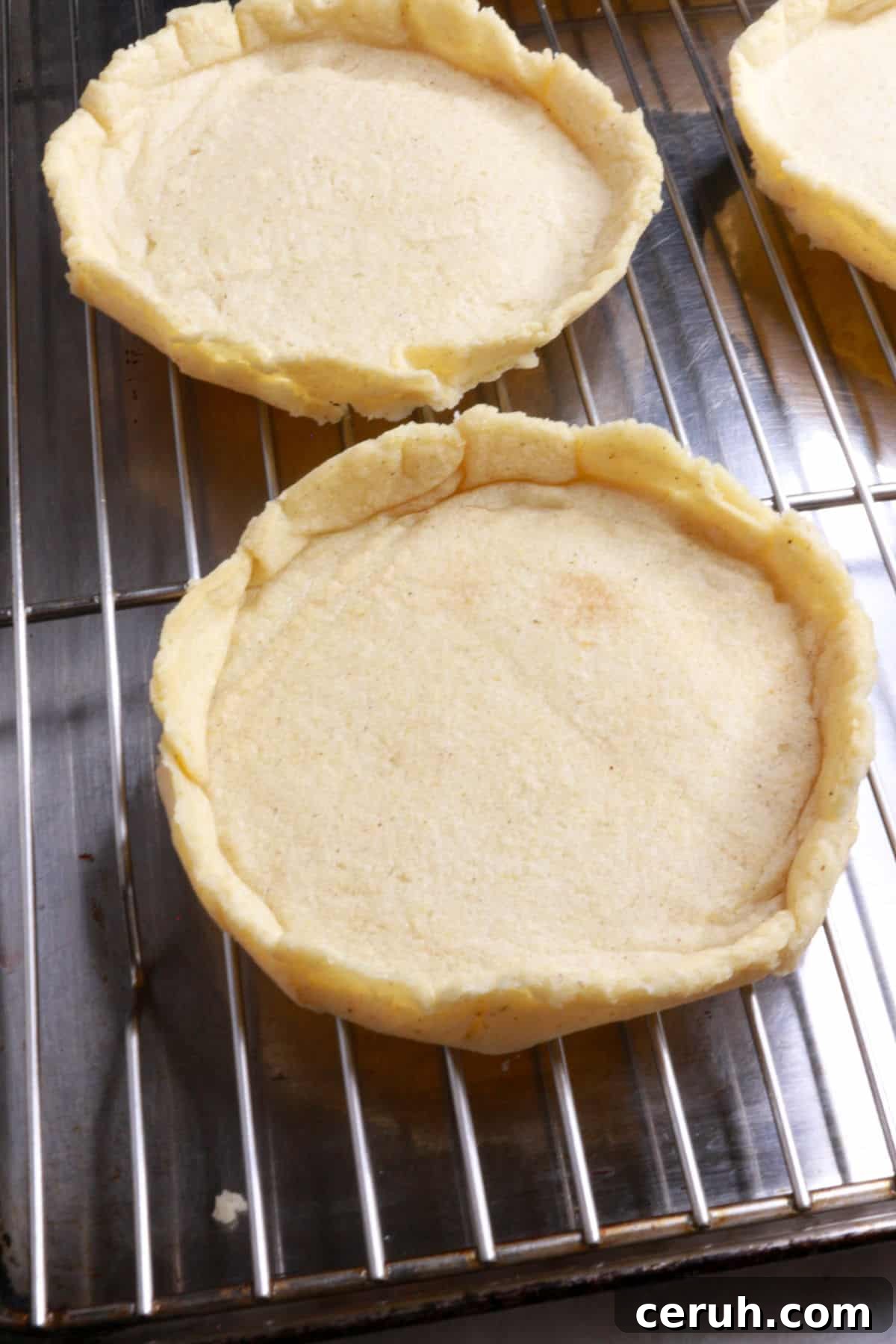 Par-cooked sopes with ridges on a wire rack