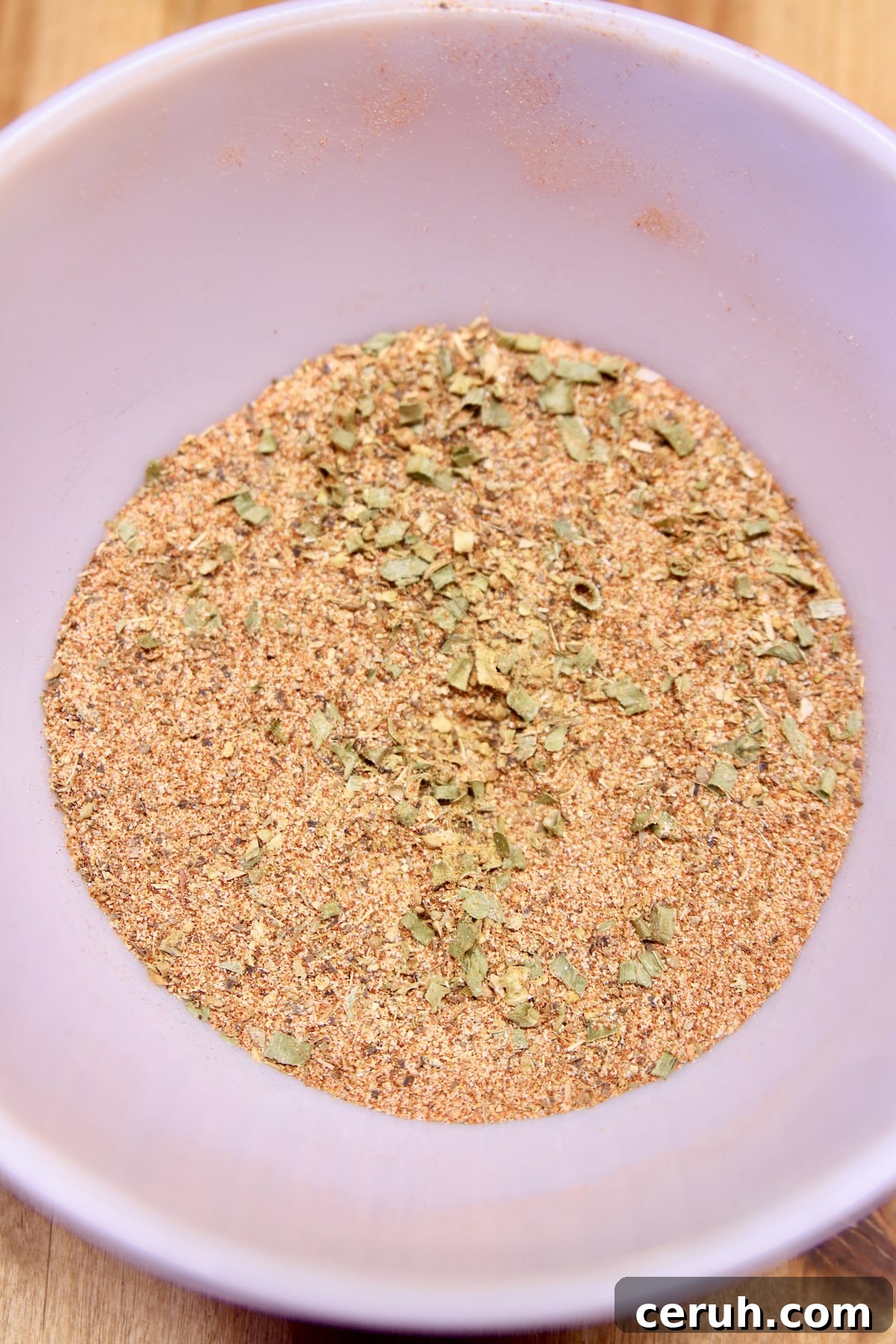 Bowl of Creole spice mix. Bowl of Creole seasoning.