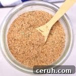 Homemade Creole Seasoning Blend: Authentic Cajun Flavor Recipe 2 Bowl of Creole Seasoning with a wooden spoon.