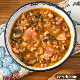 Slow Cooker Southern-Style Black-Eyed Peas Recipe 6 Black eyed peas in a white bowl with a black rim