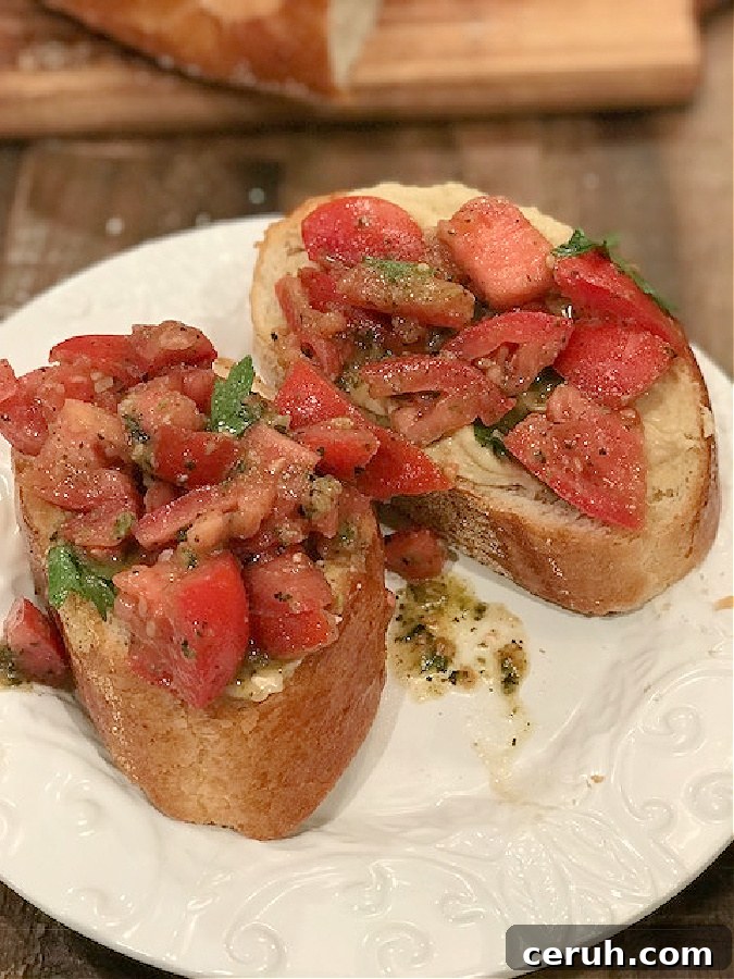 Creamy Hummus Topped with Fresh Bruschetta for Summer Entertaining 3 Bowl of fresh tomato bruschetta