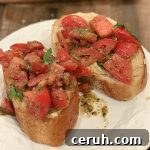 Creamy Hummus Topped with Fresh Bruschetta for Summer Entertaining 7 Recipe thumbnail
