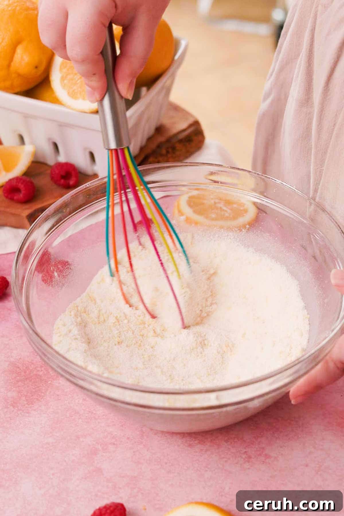stirring lemon sugar and flour with a whisk to combine in a large glass bowl