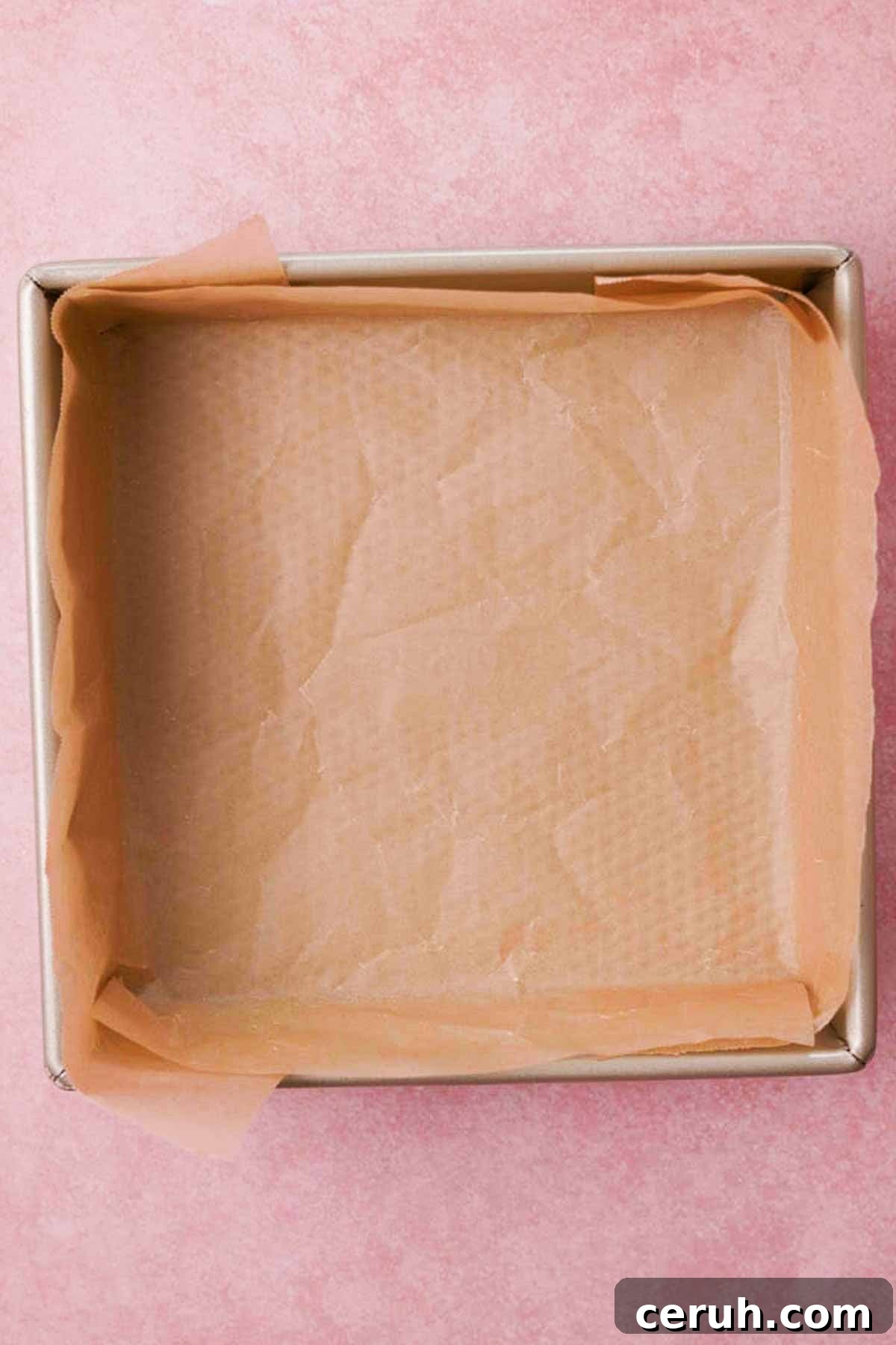 square baking pan completely lined with parchment paper