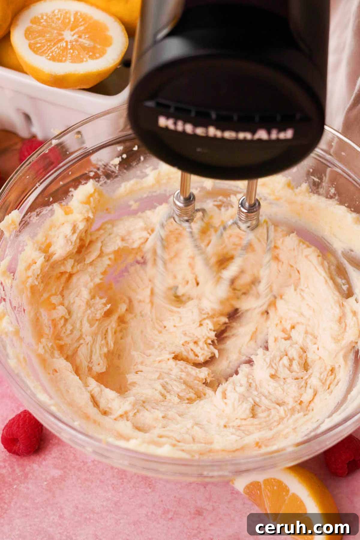 beating butter, lemon sugar, and vanilla into the crust until fluffy