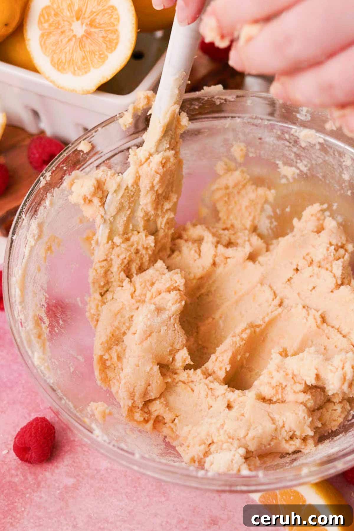 mixing shortbread dough for the crust for lemon raspberry bars