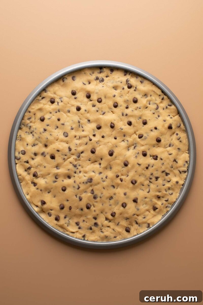 chocolate chip cookie dough in pizza pan