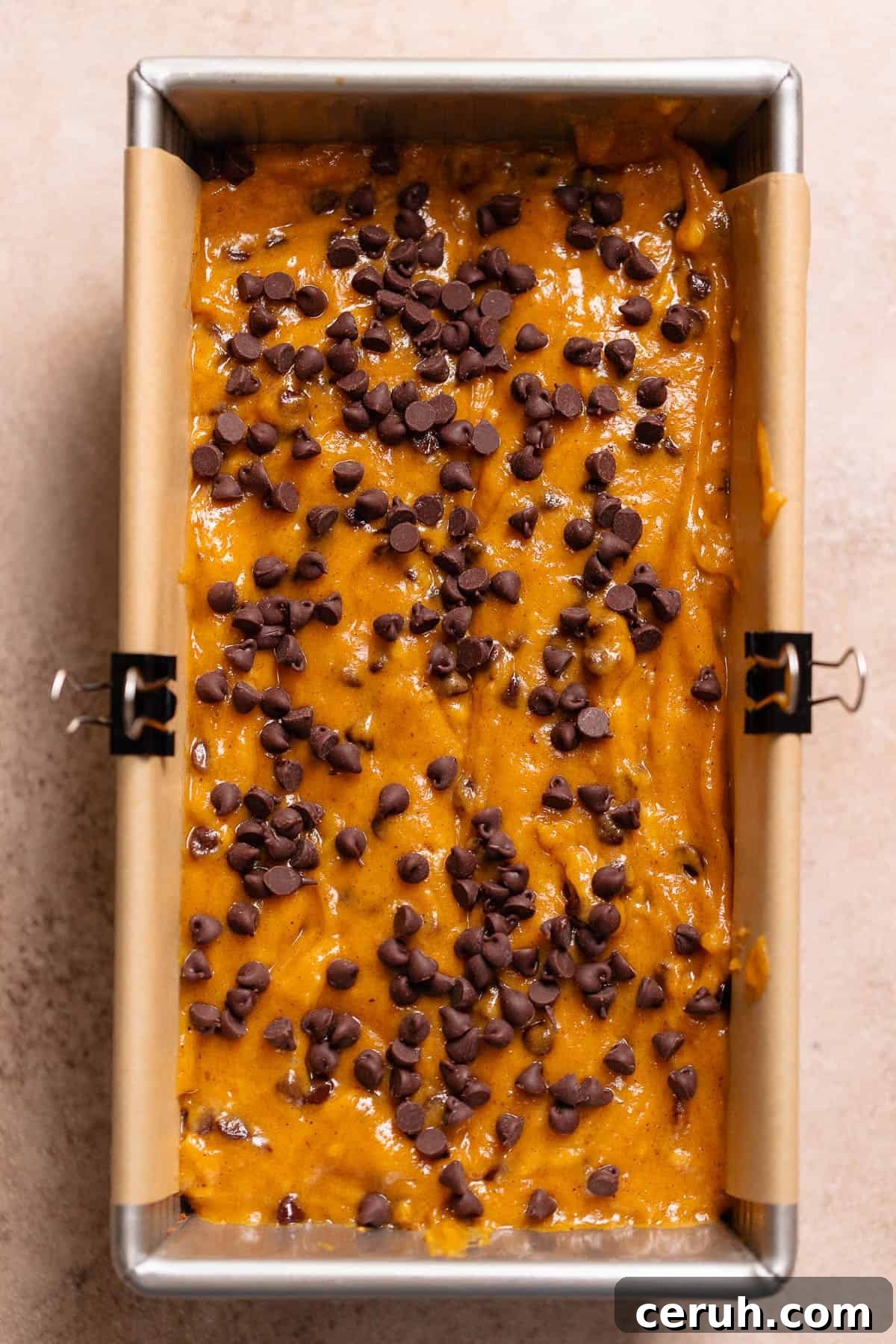 Chocolate chip pumpkin bread batter in a loaf pan.