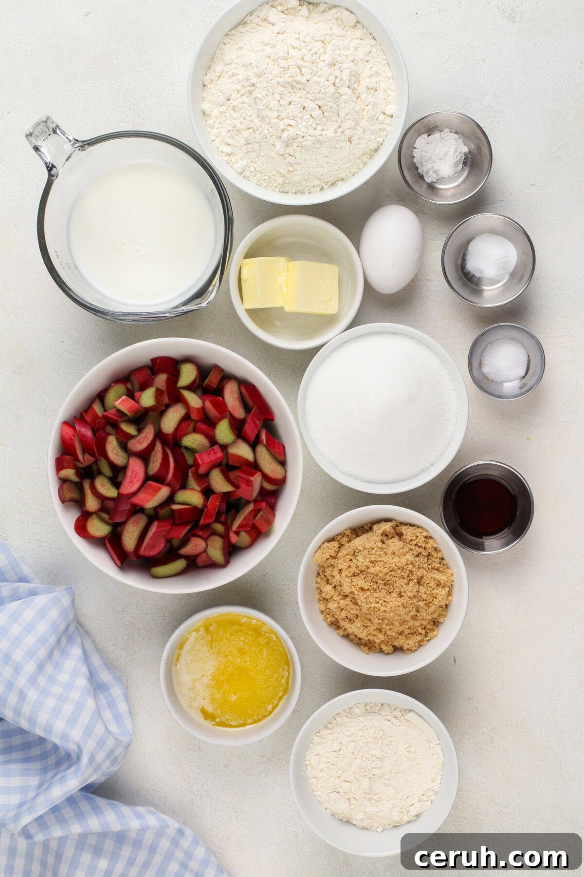 Ingredients for rhubarb streusel cake arranged on a countertop.