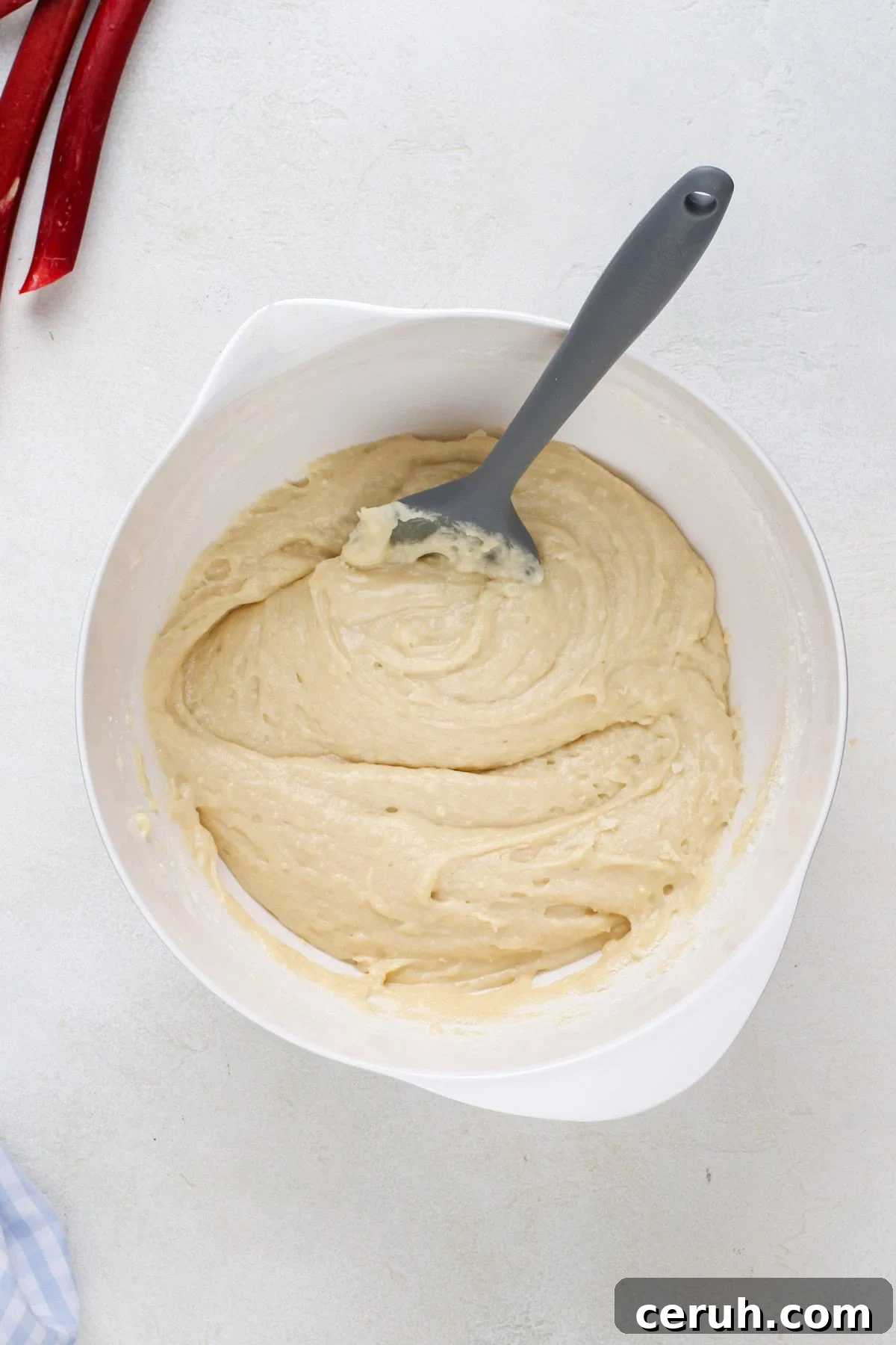 Cake batter in a white mixing bowl.