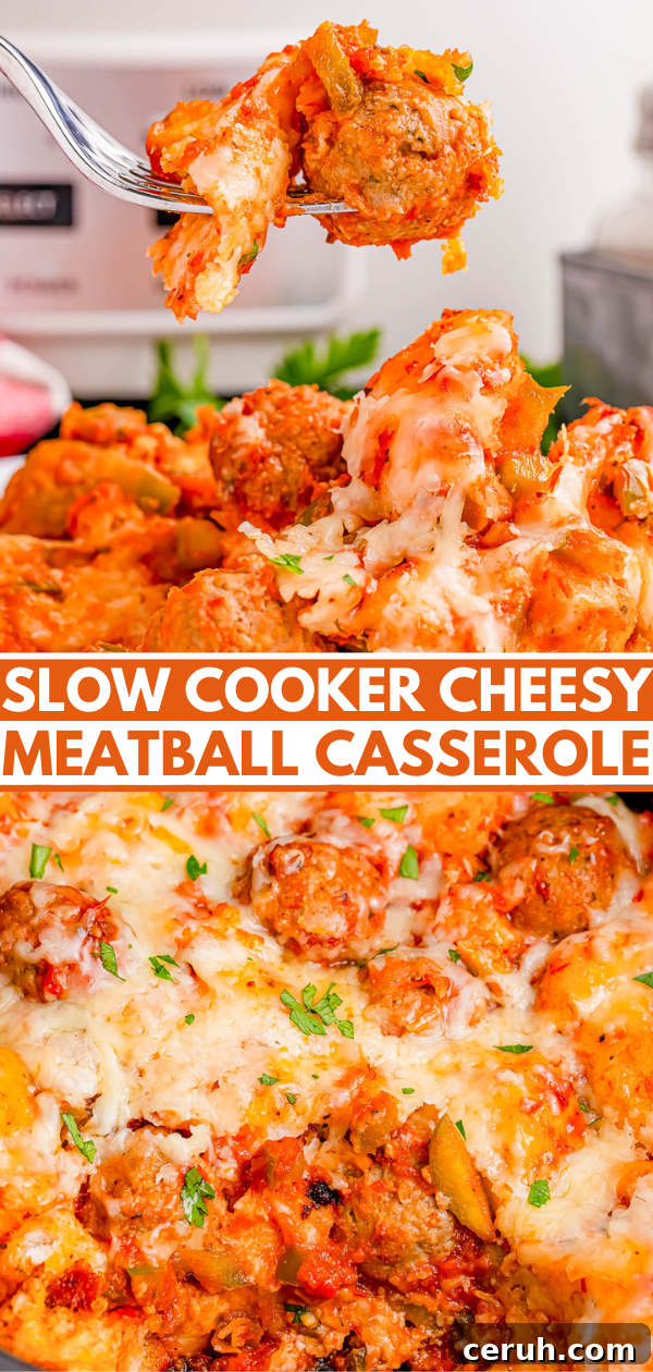 A fork holds a cheesy meatball from a slow cooker casserole, topped with melted cheese and herbs.