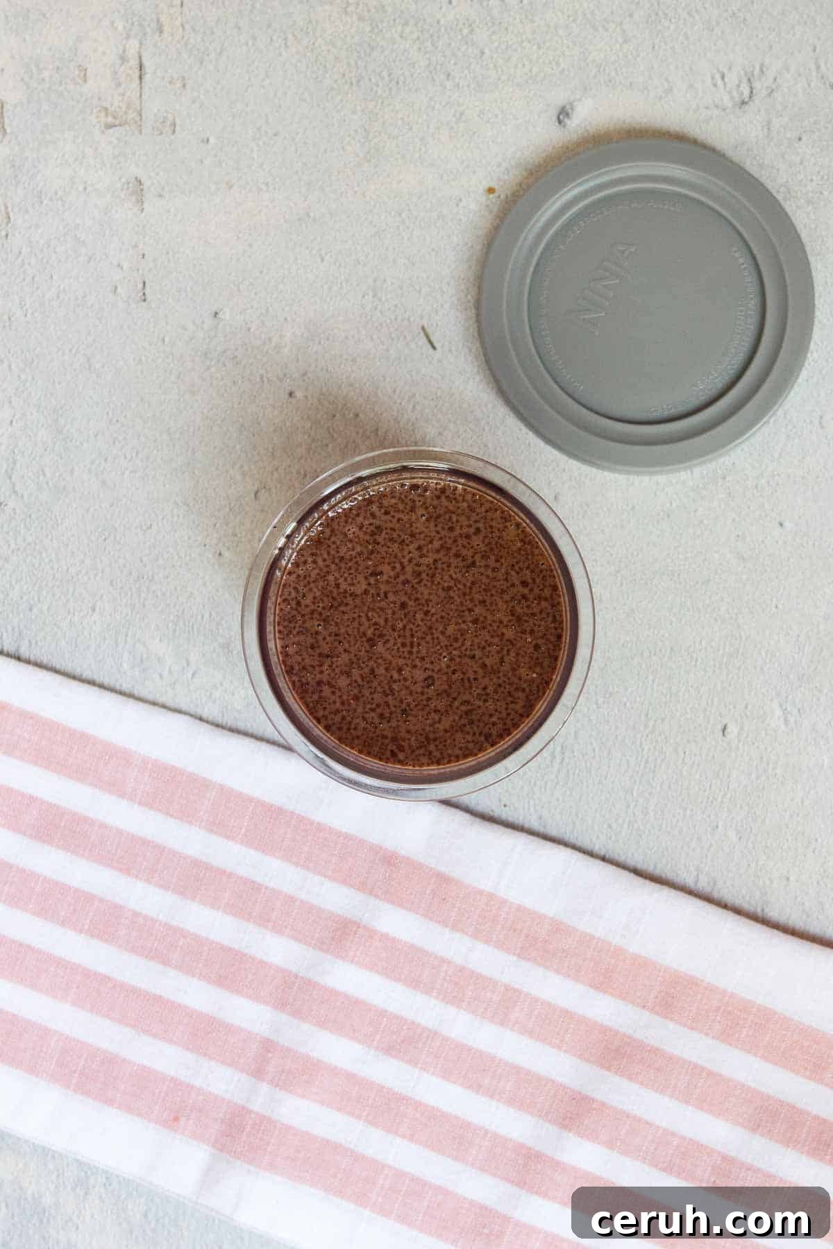 Ninja Creami Chocolate Protein Ice Cream mixture in a standard creami pint before freezing