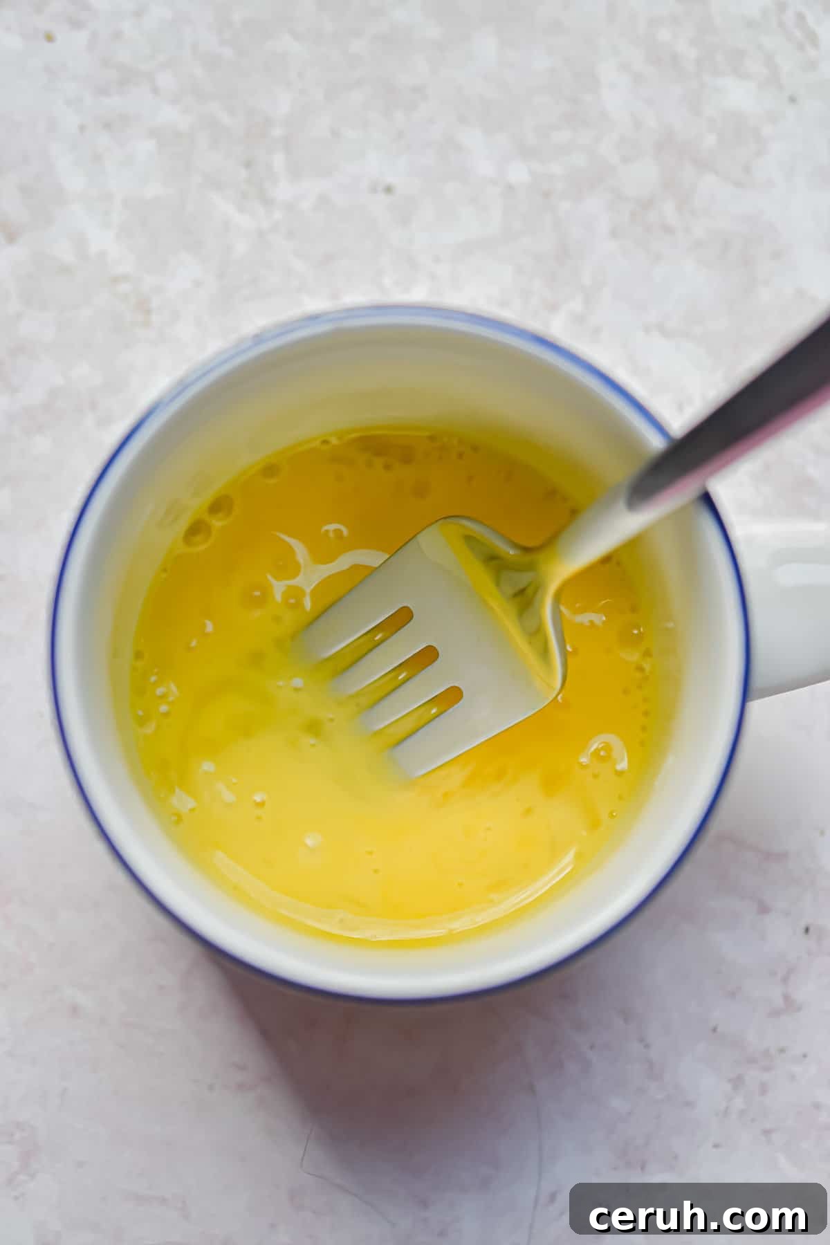 The egg s scrambled in the mug.