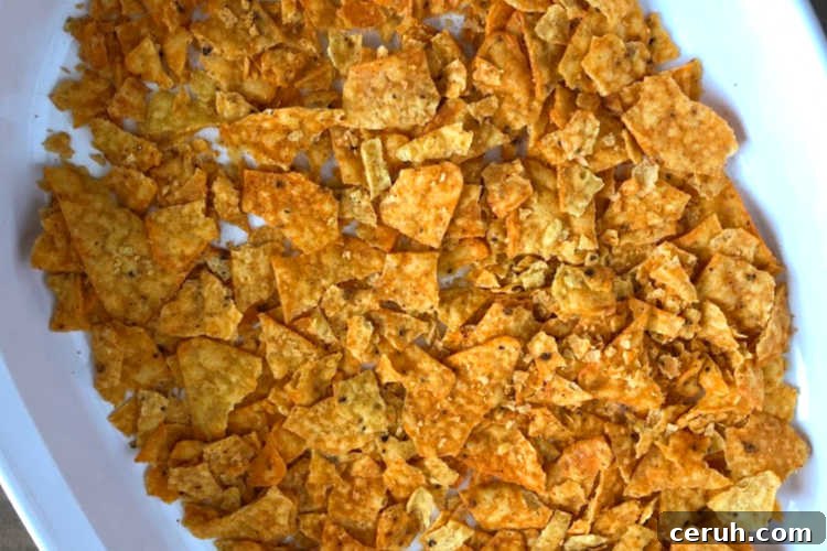 crushed doritos nacho cheese chips in casserole dish