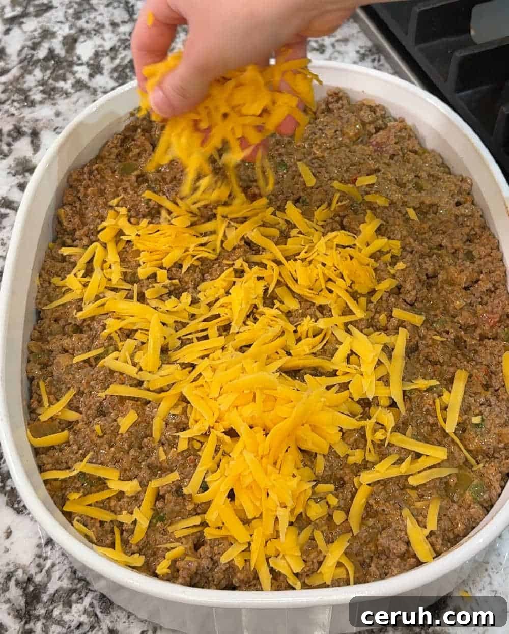 sprinkle cheese over beef.