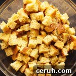 Gluten-Free Stuffing Cornbread - Savory, tangy, dense. This cornbread is perfect for stuffing with enough structure to stand up to mixing. | justalittlebitofbacon.com