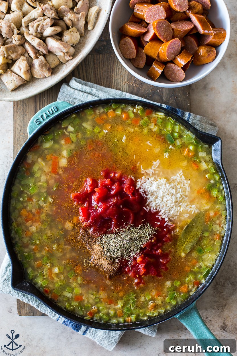 Overhead photo of a skillet of veggies, spices and broth