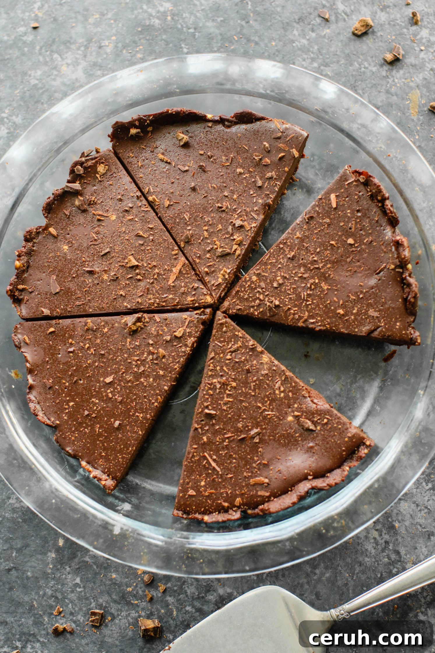 Vegan Chocolate Pie with 2 slices missing in pie pan by Flora & Vino