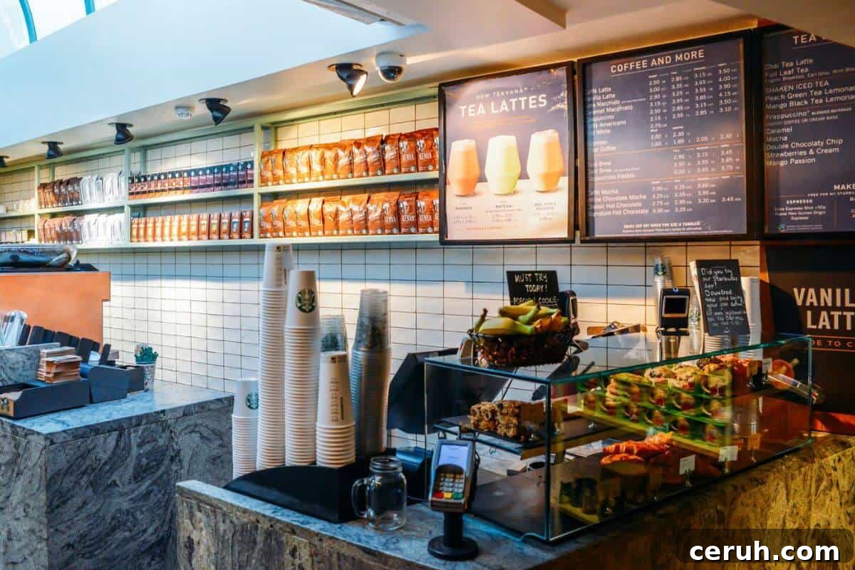 The interior of a coffee shop with shelves displaying menu options.