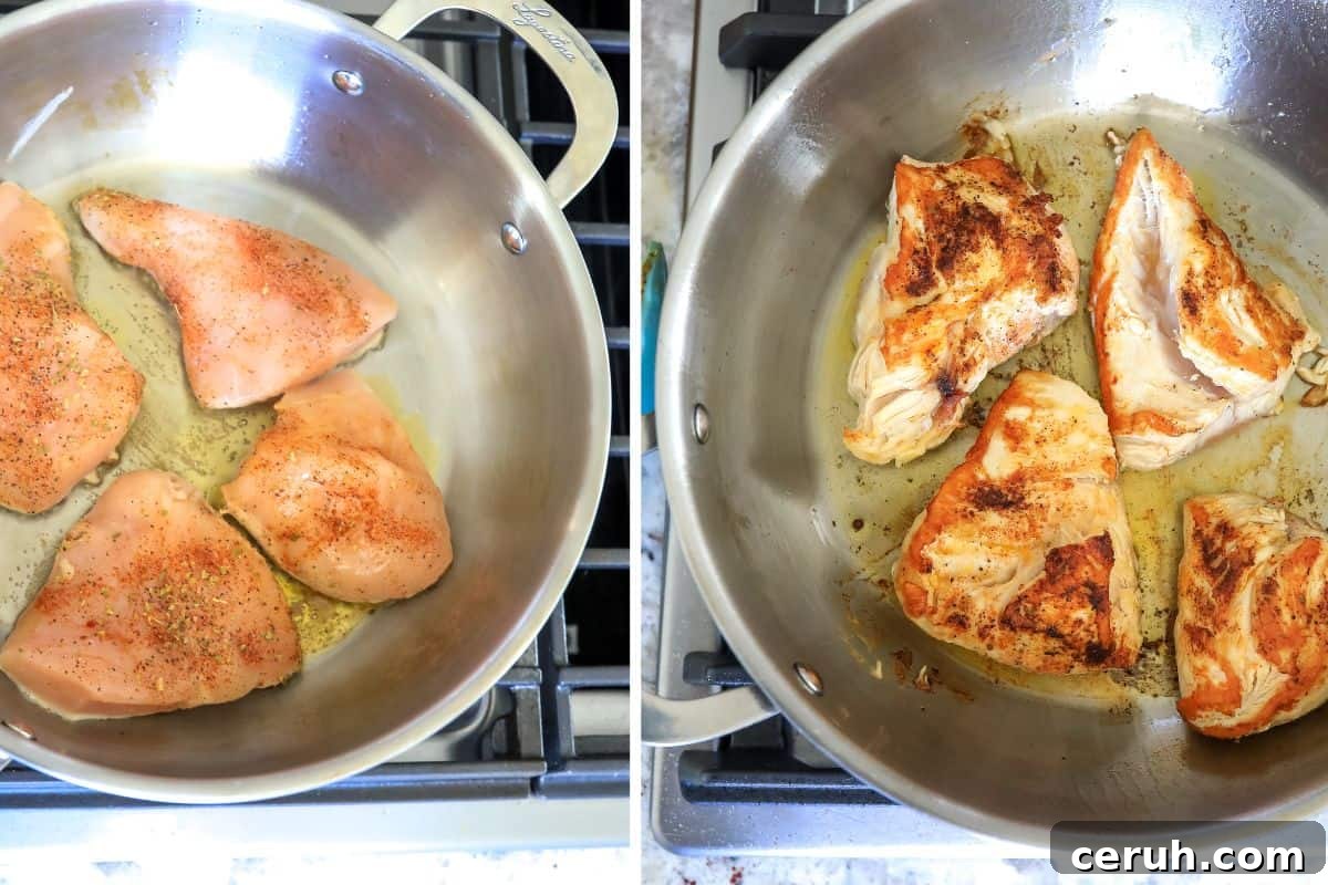 Chicken raw in a skillet with oil. 
