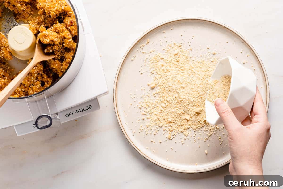 finely chopped cashews being poured out onto a plate