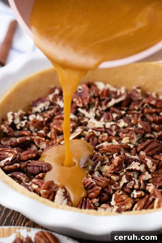 Pouring pecan pie filling over chopped pecans.