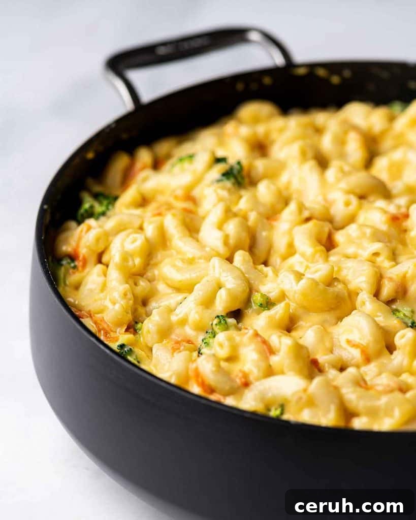 Angled view of a pan with copycat panera broccoli cheddar mac and cheese.