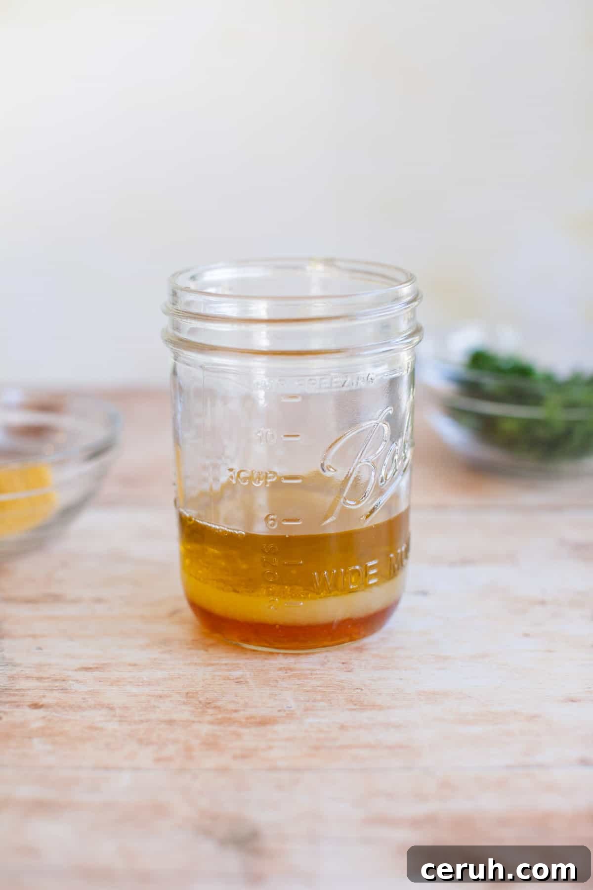 honey added to a mason jar of marinade