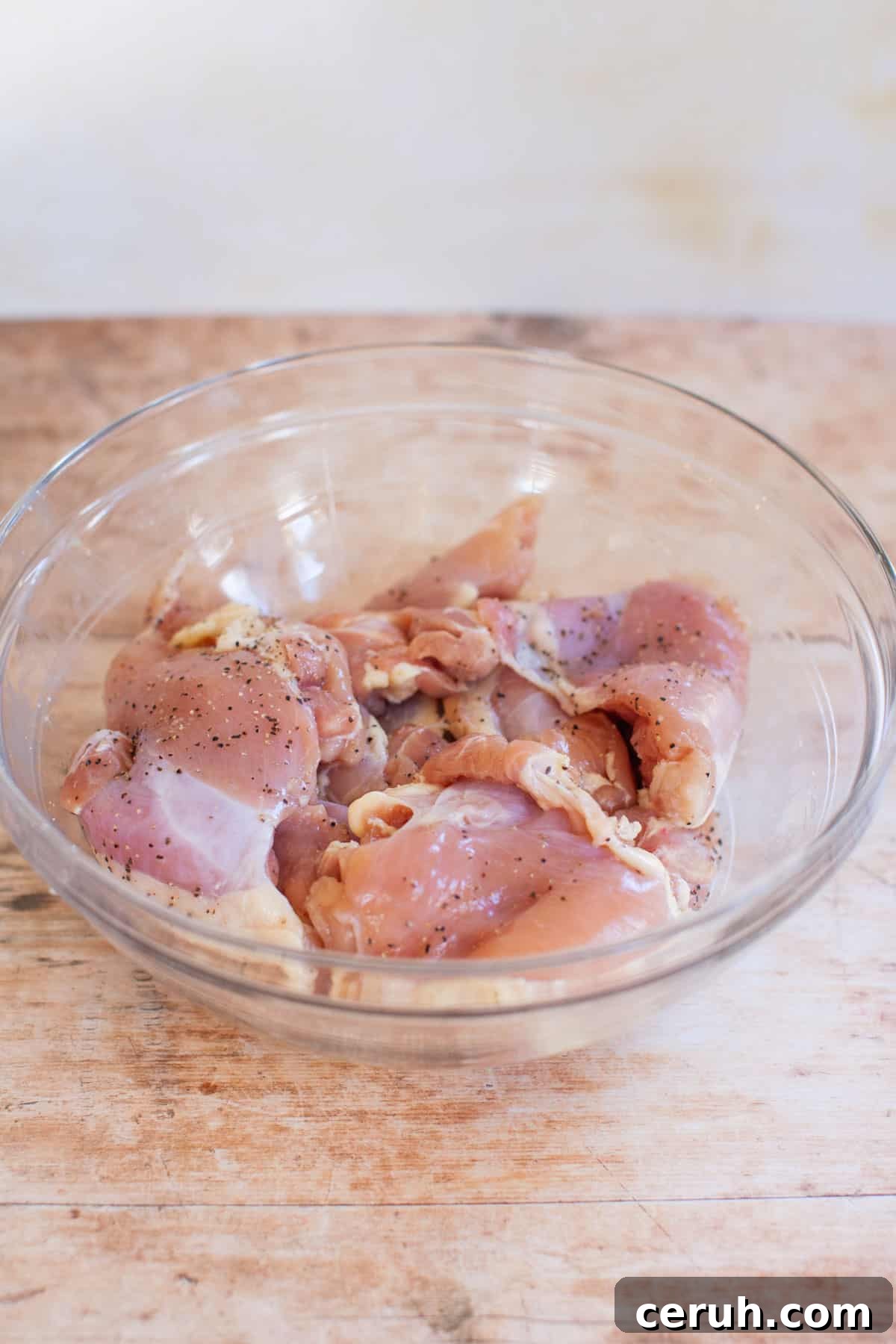 raw chicken thighs in a bowl