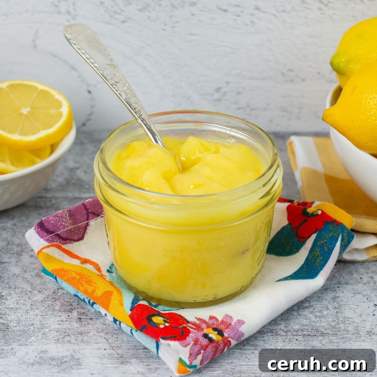 Homemade lemon curd in a glass jar.