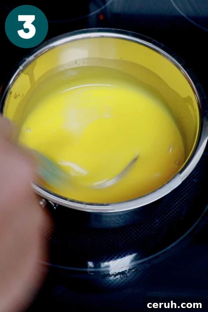 heating heavy cream, sugar, and yolks in a saucepan