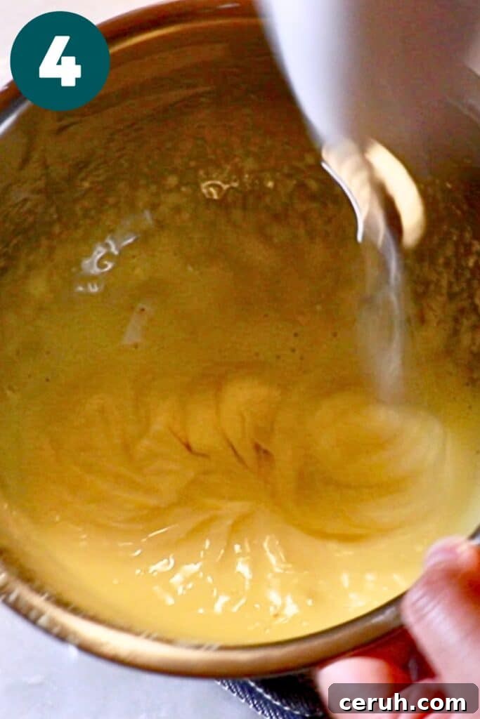 whipping the yolk mixture with a hand mixer