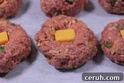 adding cheese to meatballs