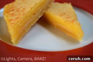 Sticky Lemon Bars Recipe (Video Guide) 2 Sticky Lemon Slice. A shortbread like base with a sweet yet tangy lemon topping! The texture is very melt in the mouth, almost like a custard!