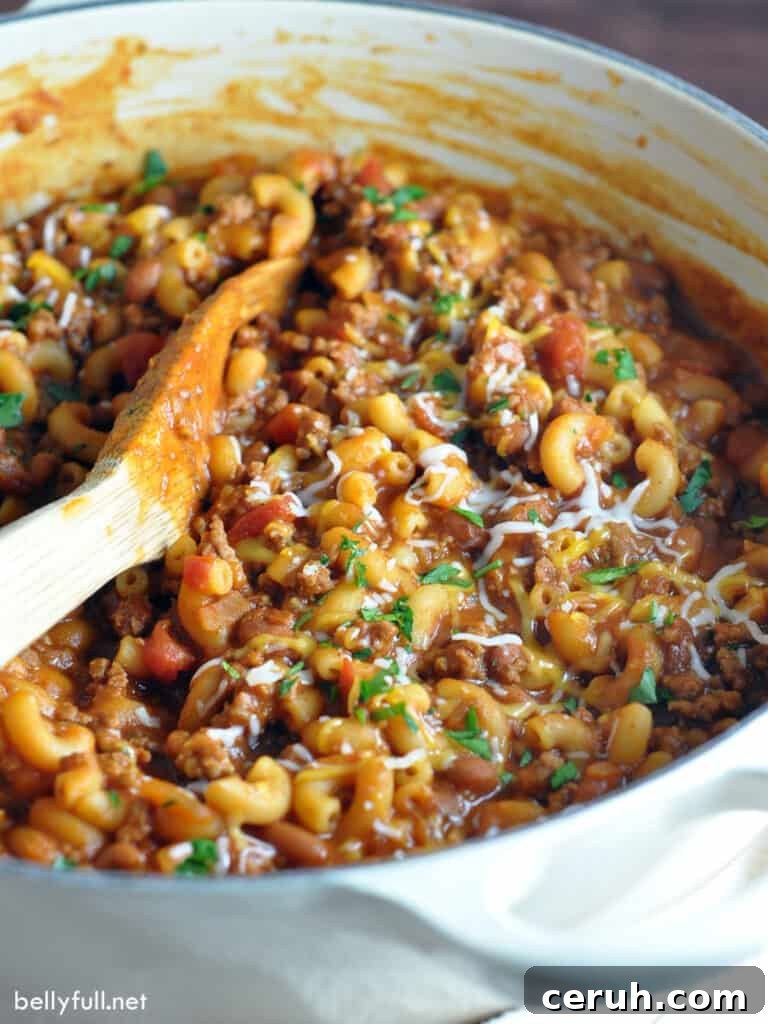 pot of chili mac with wooden spoon