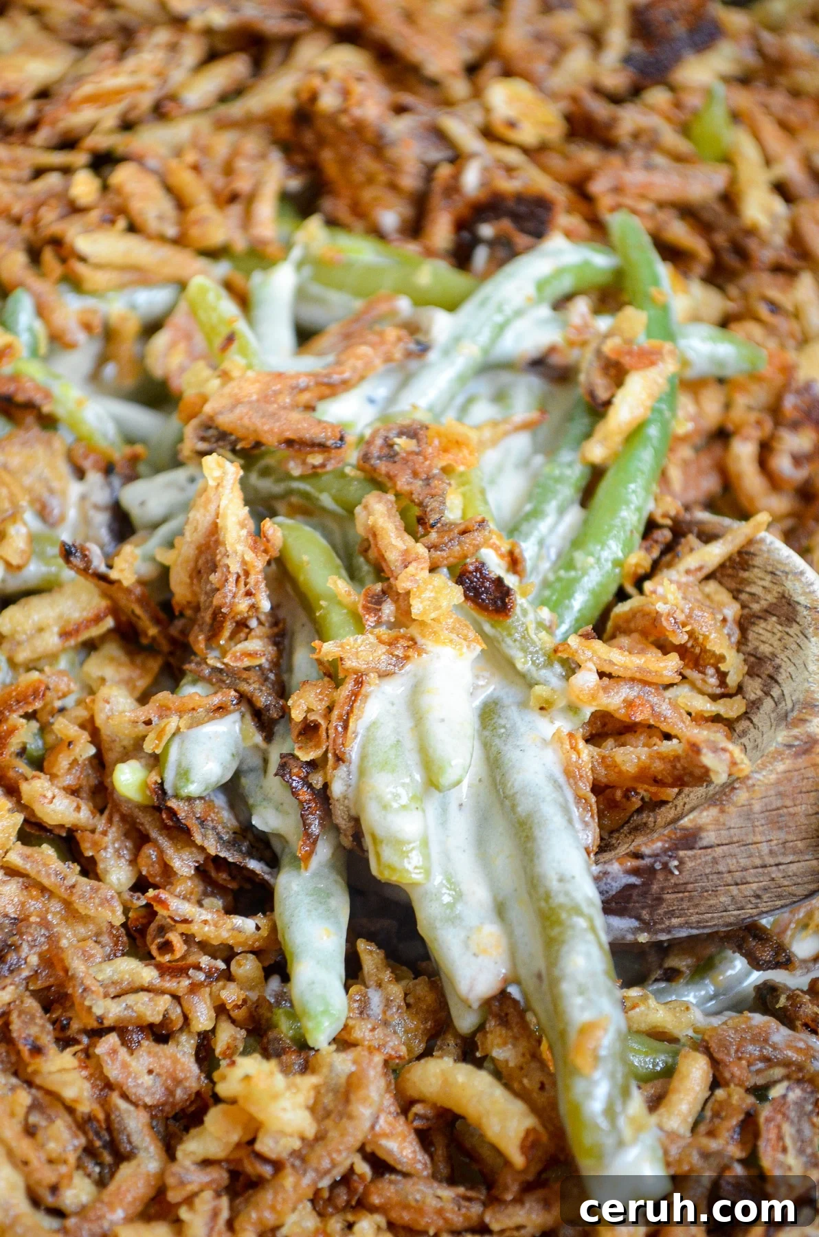 Creamy Slow Cooker Green Bean Casserole for Holidays 3 A close up of green bean casserole.