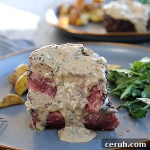 medium rare filet mignon cut in half with peppercorn sauce