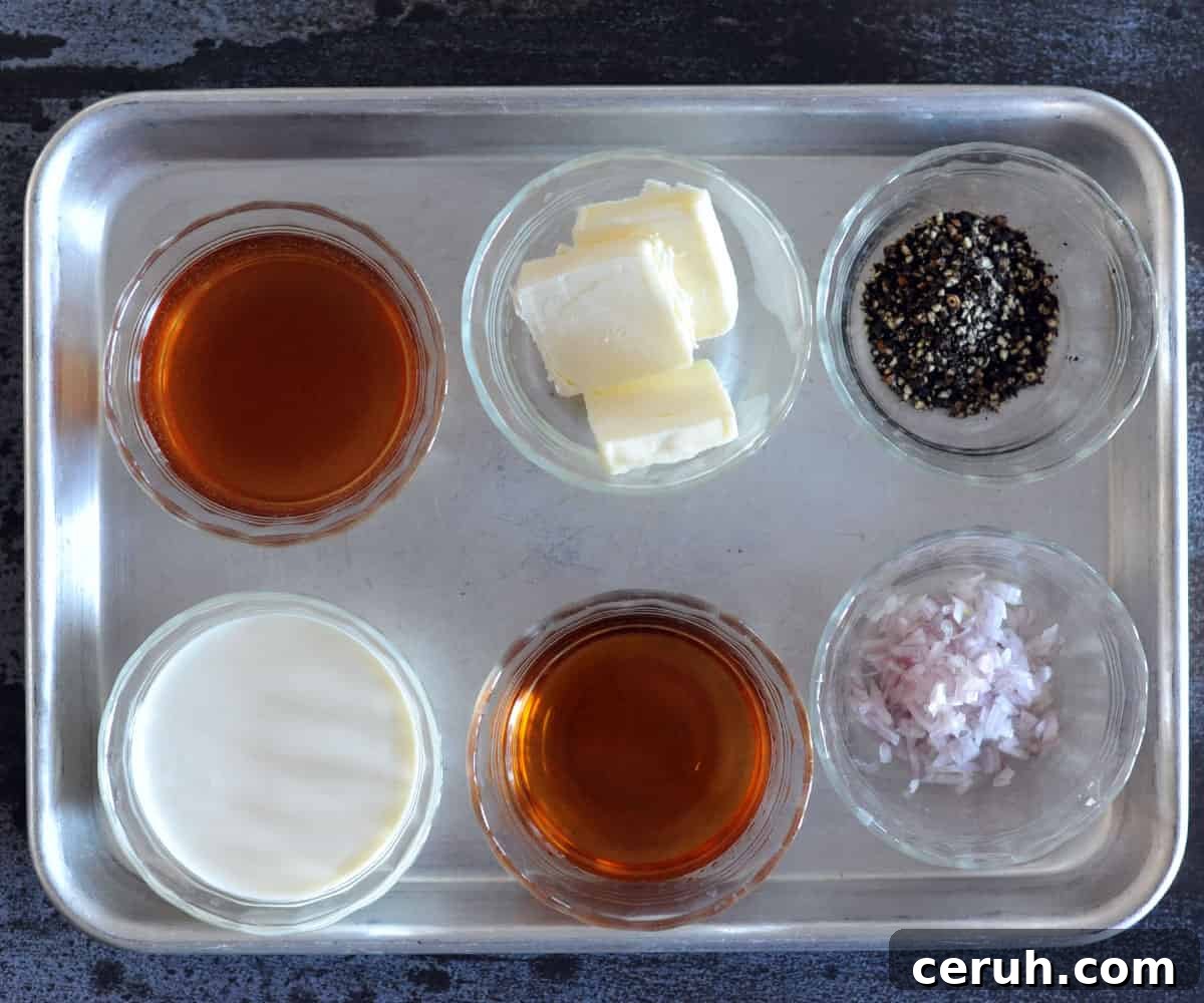 peppercorn sauce ingredients in bowls.