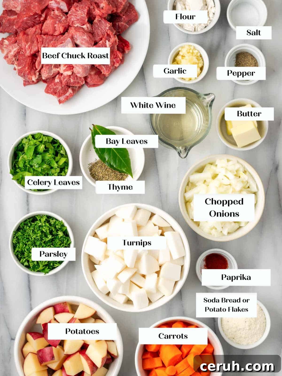 beef stew ingredients on marble.