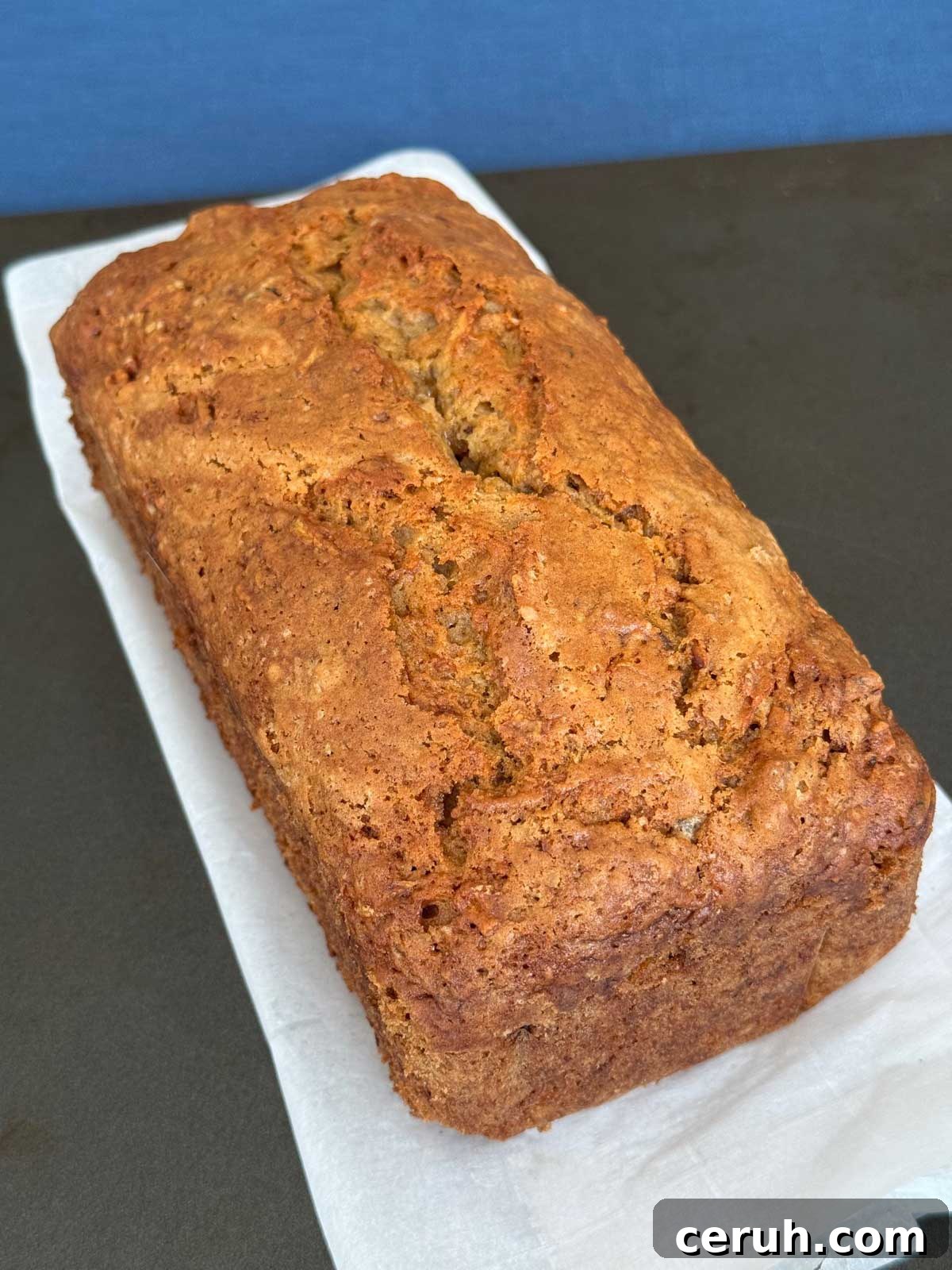 A loaf of sourdough zucchini bread made with sourdough discard, zucchini, carrots and apples.