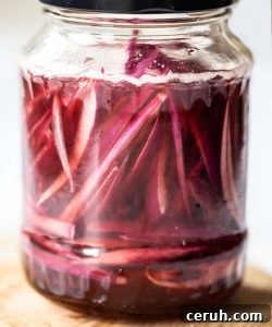 Pickled Onions close up shot of pickled onions in glass jar