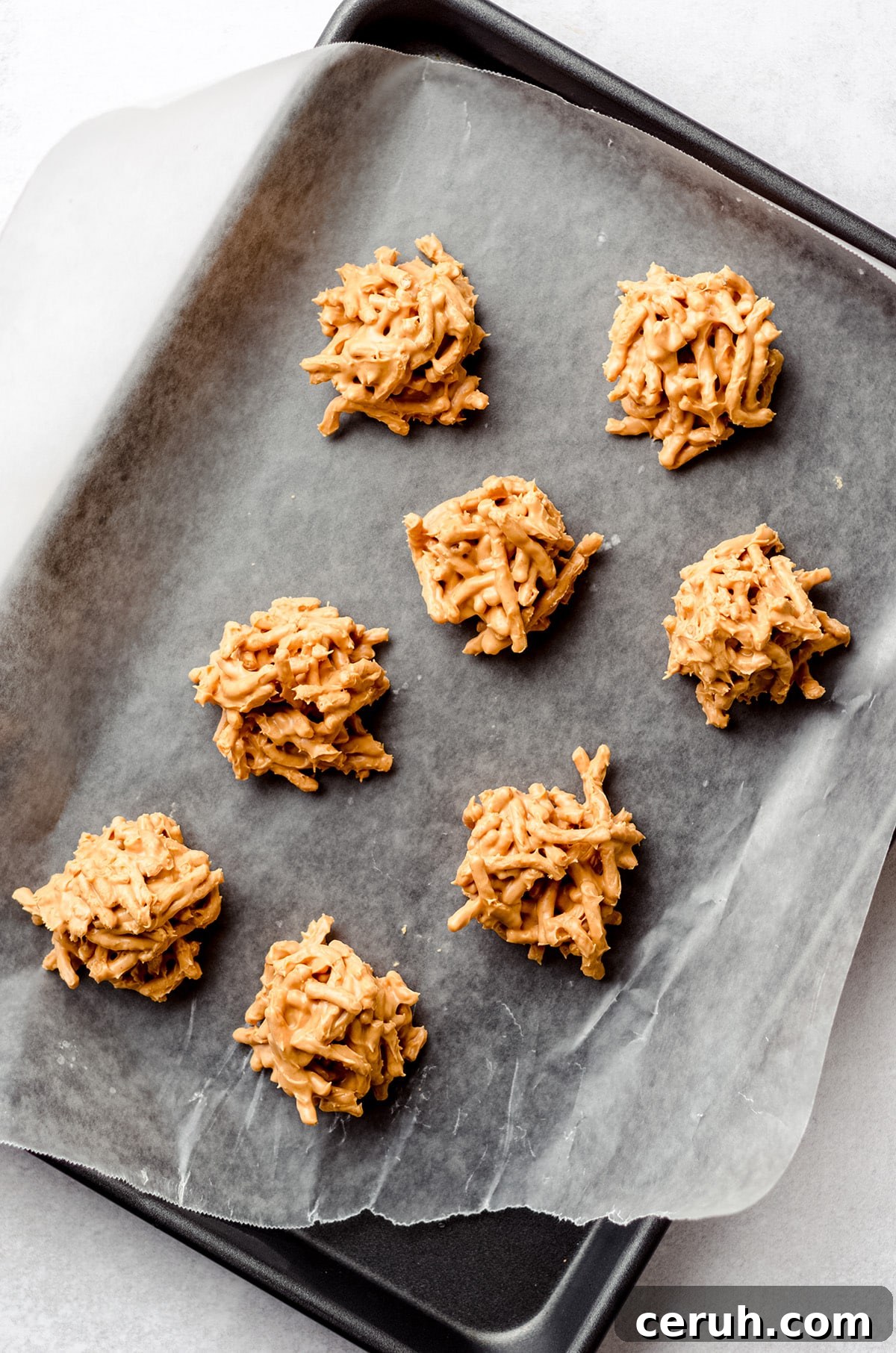 Chewy Butterscotch Haystack Cookies Recipe for Crowd-Pleasing Treats 2 A baking sheet with butterscotch no bake cookies.
