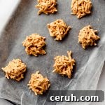 Chewy Butterscotch Haystack Cookies Recipe for Crowd-Pleasing Treats 14 No bake butterscotch cookies on lined baking sheet.