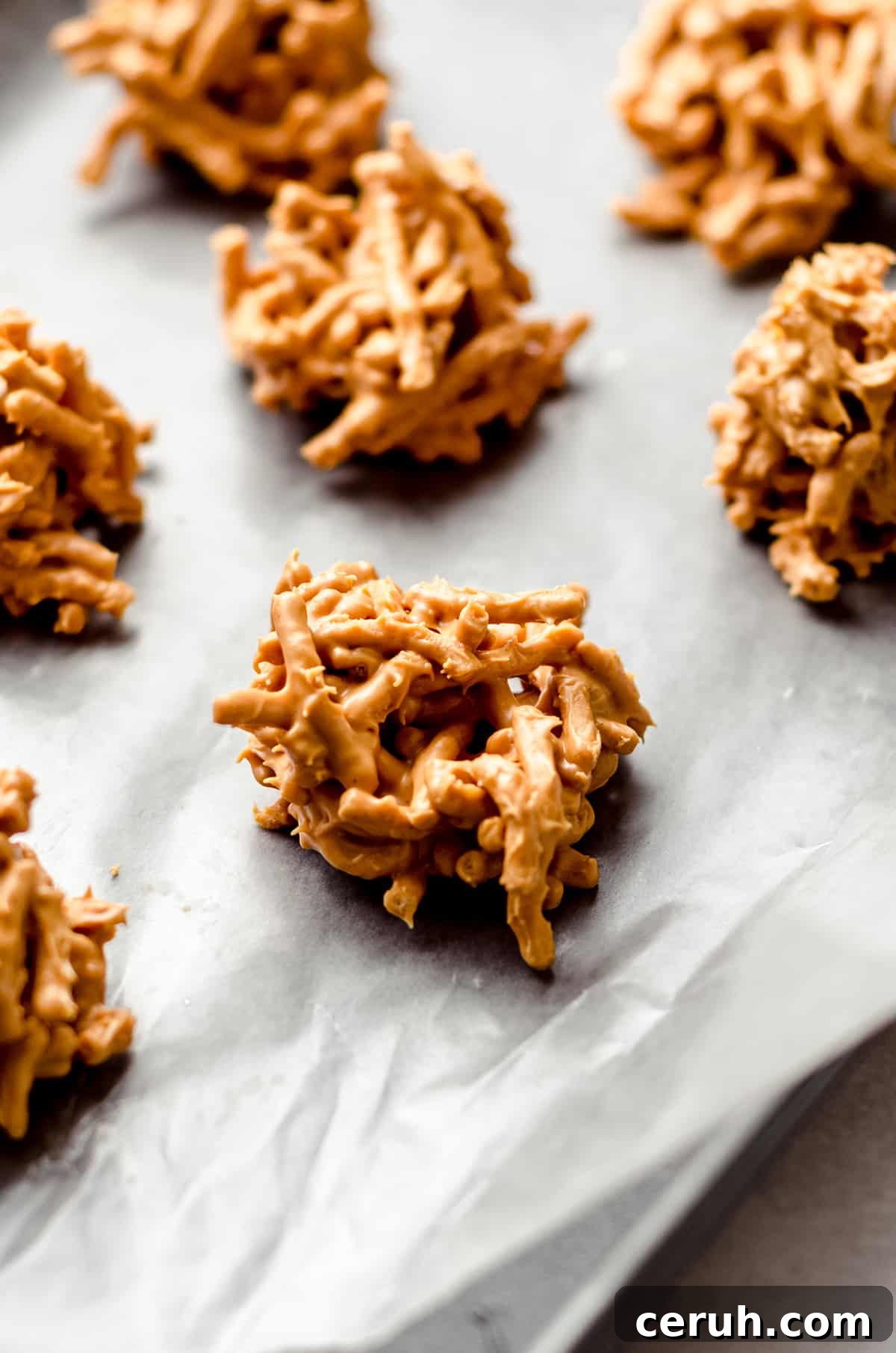 Chewy Butterscotch Haystack Cookies Recipe for Crowd-Pleasing Treats 5 A baking sheet with mounds of chow mein cookies on it.