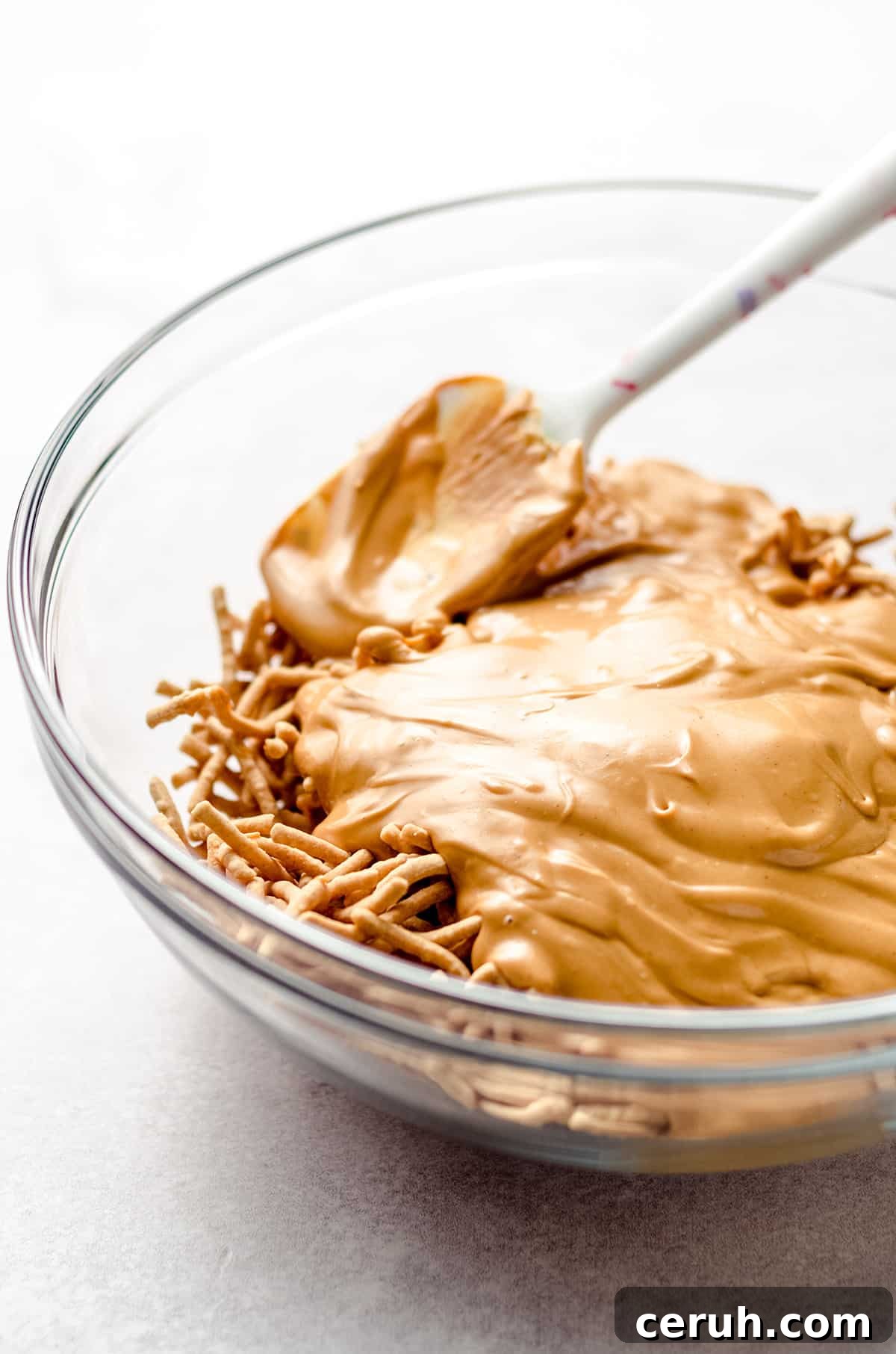 Chewy Butterscotch Haystack Cookies Recipe for Crowd-Pleasing Treats 9 Adding melted butterscotch chips and peanut butter on top of chow mein noodles.
