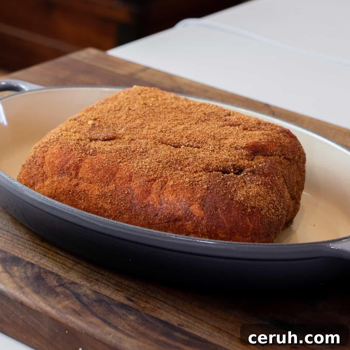 Pork roast covered with a seasoning rub.