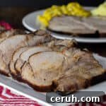 A platter with sliced pork roast.