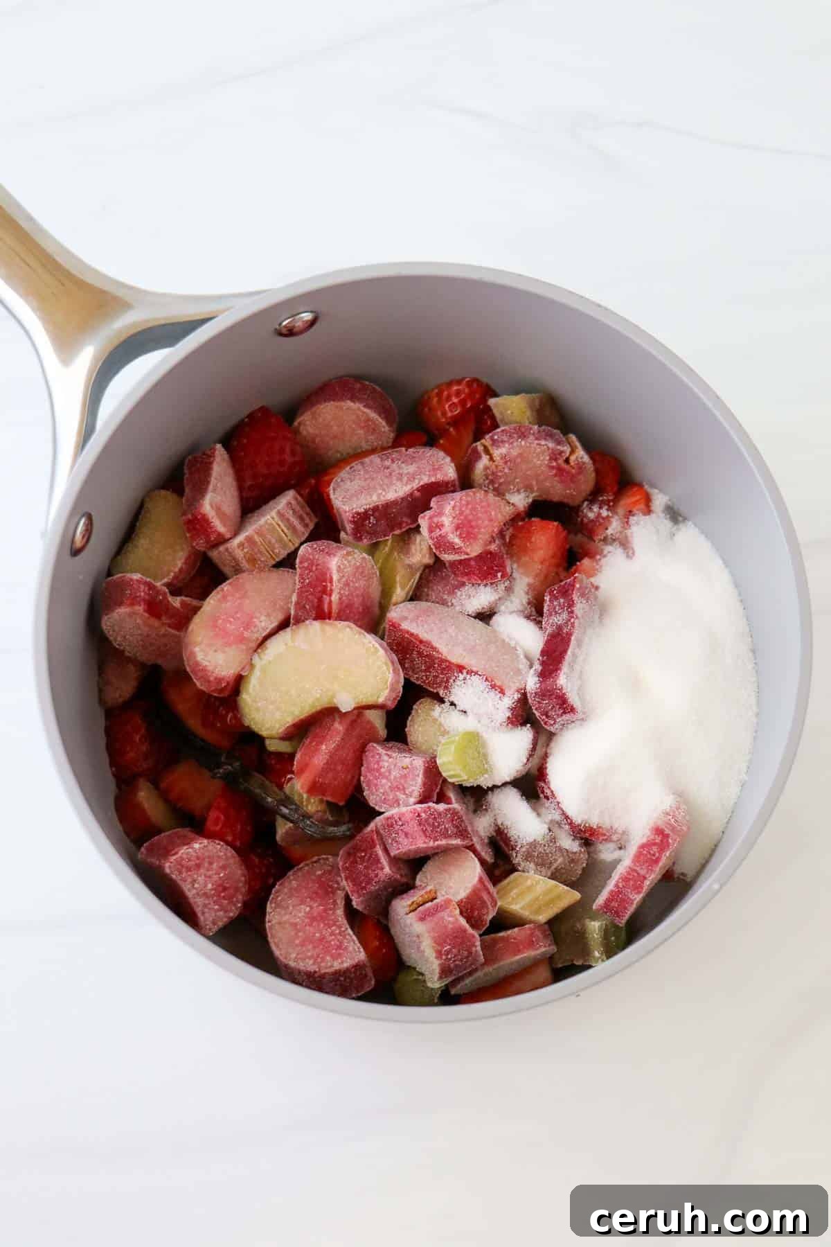 Strawberry Rhubarb Compote Recipe: Quick Homemade Fruit Sauce 4 Rhubarb and strawberries in a saucepan with sugar.