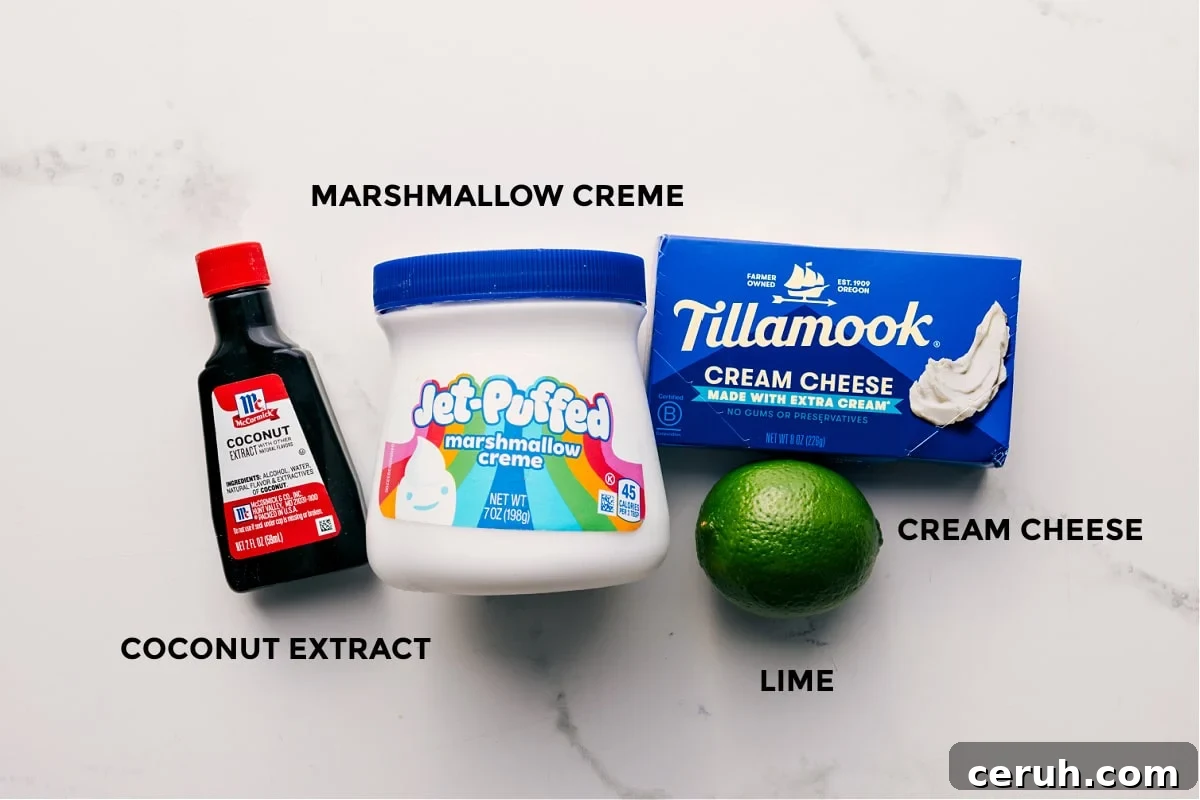 All the ingredients in this recipe prepped out for easy assembly including the coconut extract, marshmallow creme, cream cheese, and lime.